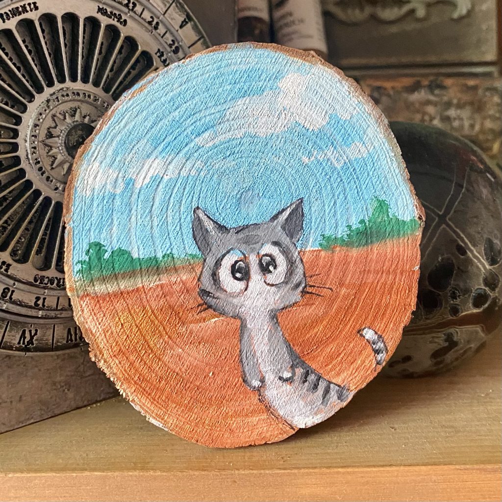 Holzscheibe handbemalt „Tigerkatze auf Abenteuern”